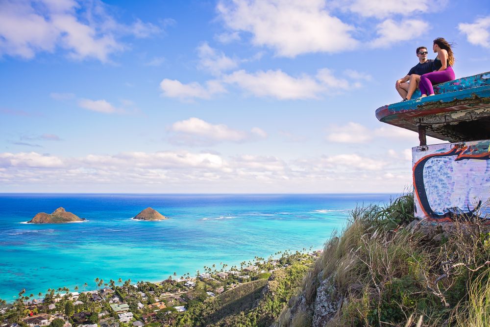 Couple sitting on a pillbox at Lanikai Beach