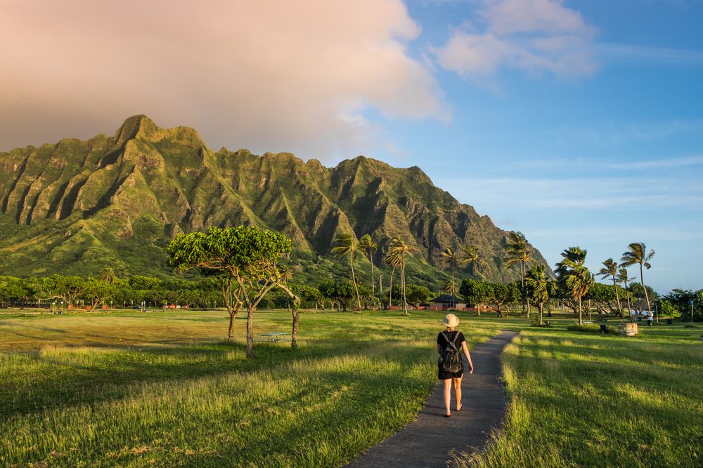 A person walking along a trail at Kualoa Regional Park