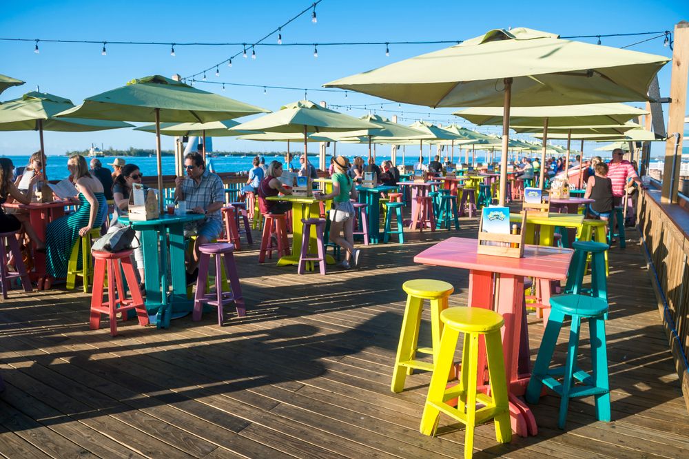 Chairs and tables on Mallory Square's sunset pier