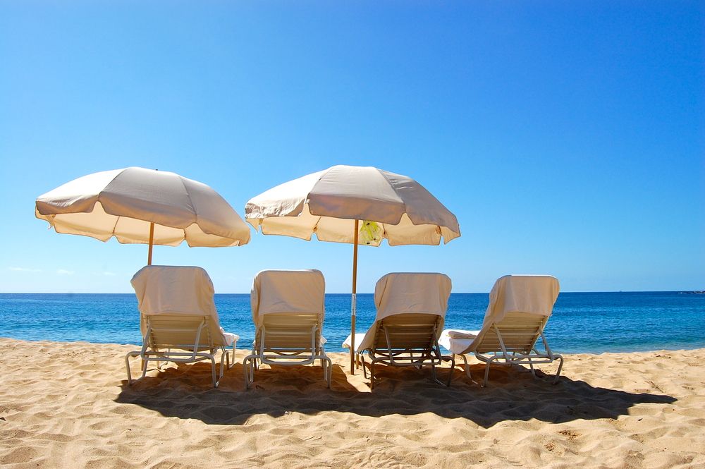 Beach chairs and umbrellas on Hulopoe Beach