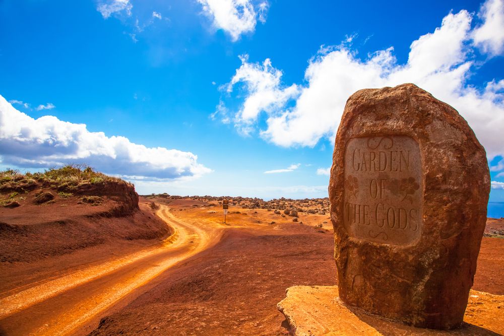 A rock with the words "Garden of the Gods"