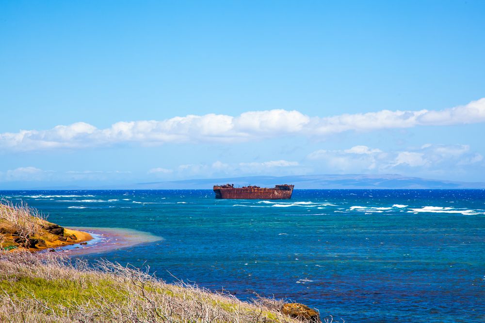 View of the rusty tanker from the shore