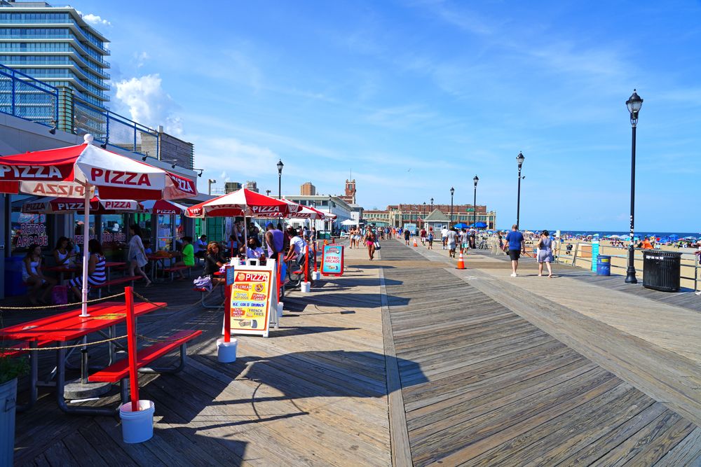 People touring the Asbury Park Boardwalk