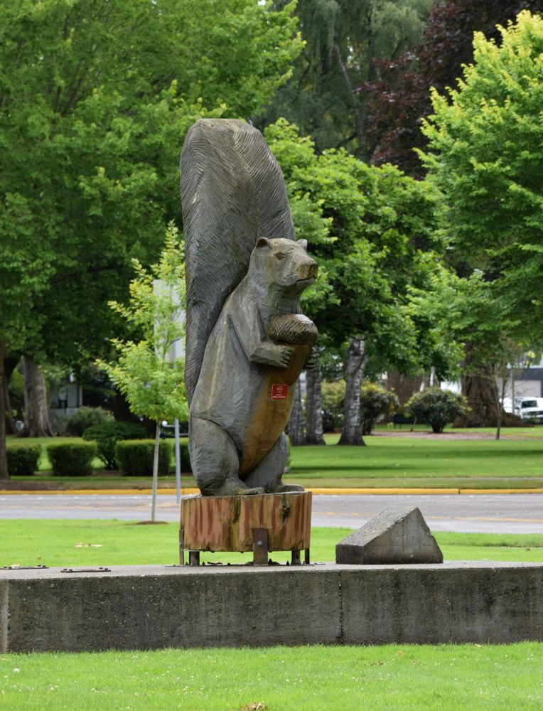 A squirrel with an acorn sculpture at Nutty Narrows Bridge