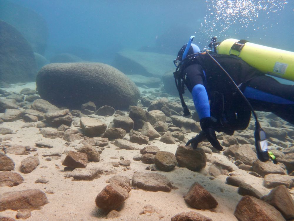Scuba diver exploring lake tahoe underwater