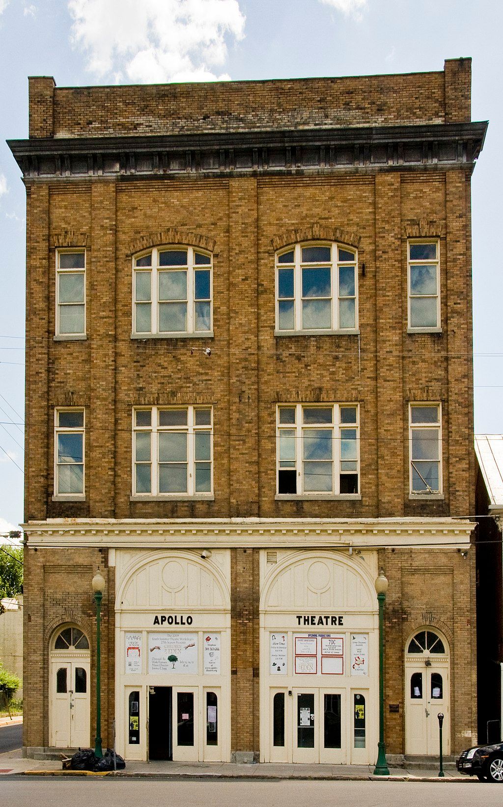 Exterior of the apollo theatre with the entrance doors open.