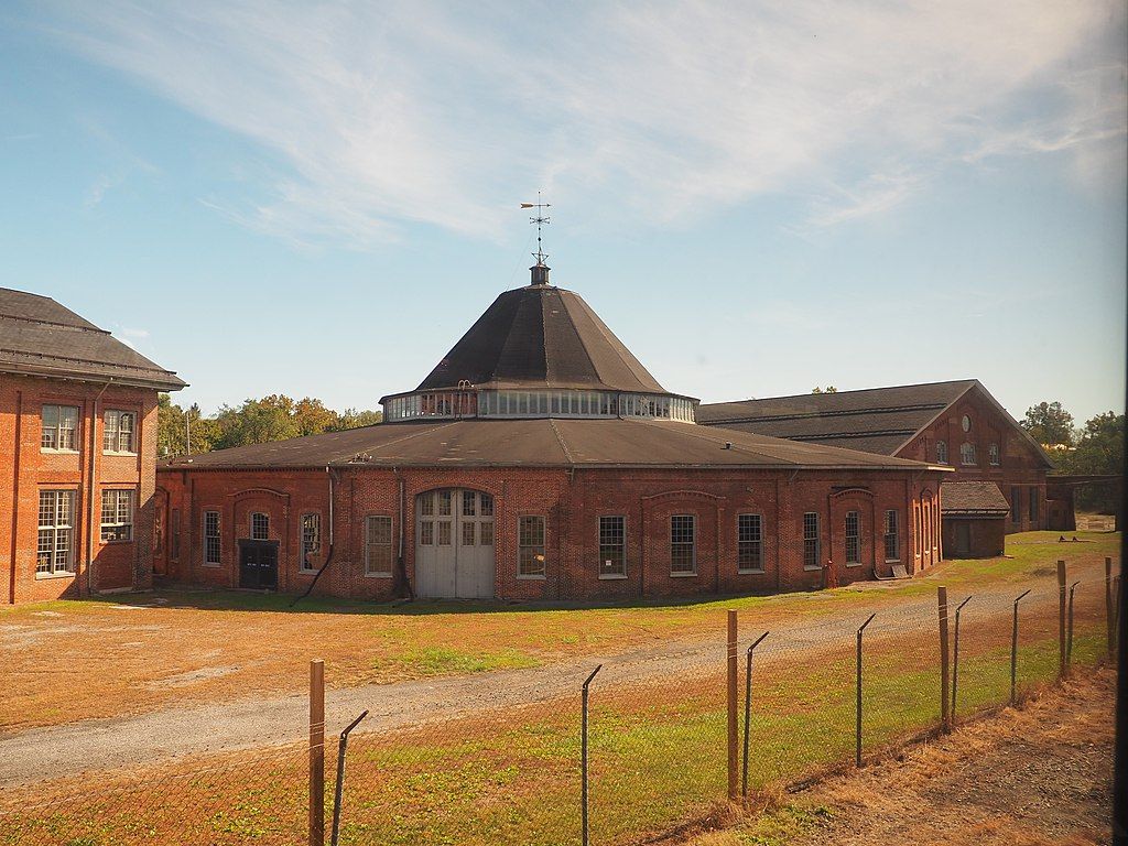 Exterior view of the martinsburg roundhouse made of brick - during a sunny day.