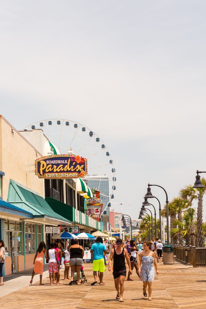People walking along the Myrtle Beach Boardwalk and Promenade