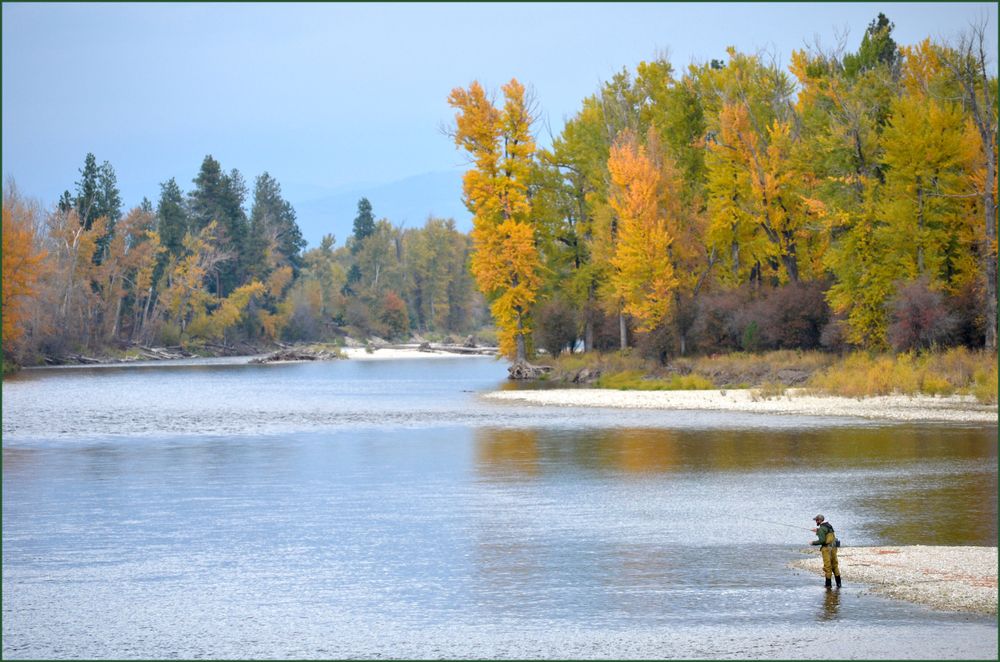 A person fishing at Bitterroot River