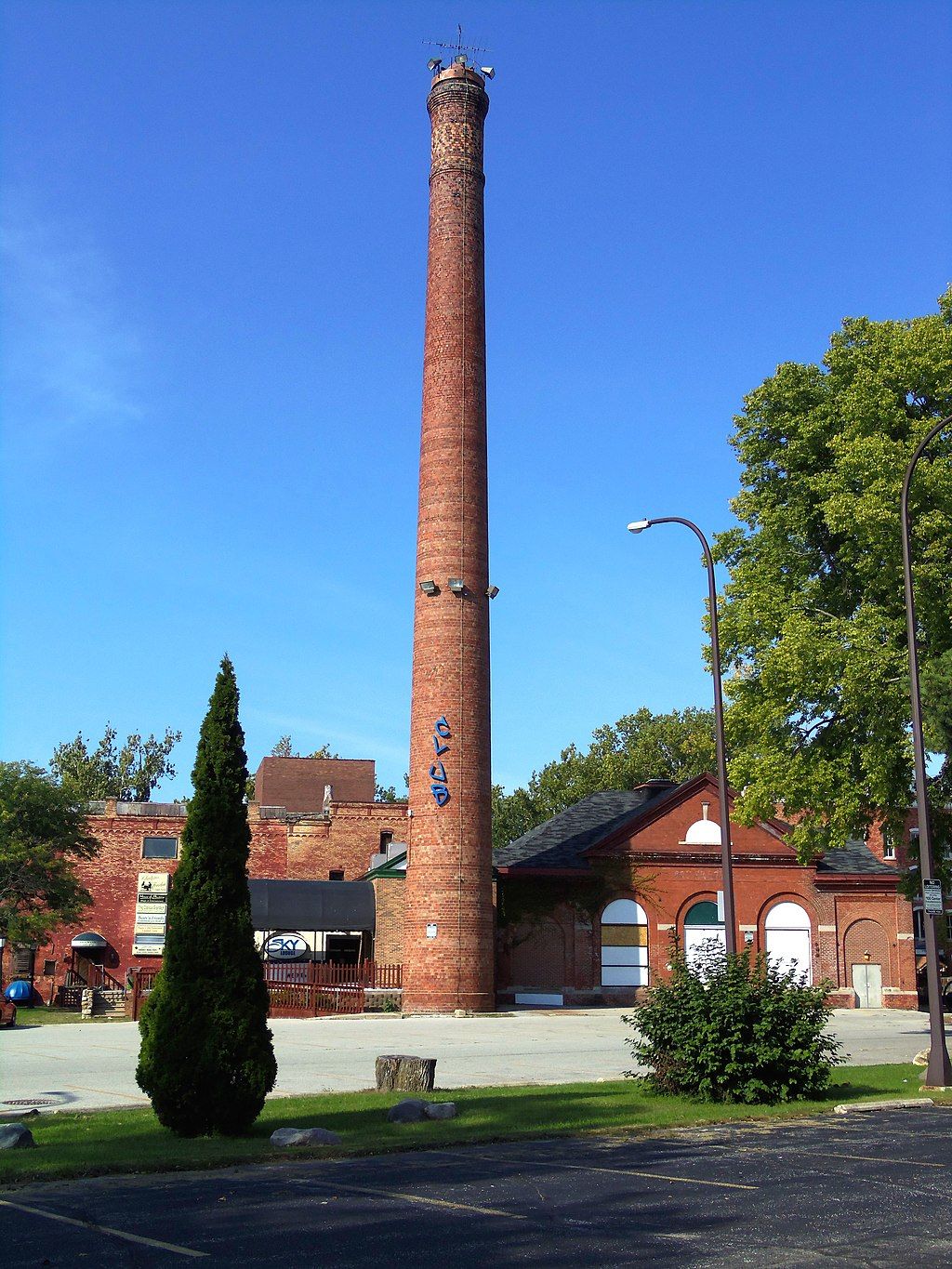 Tall smokestack building of Kamm and Schellinger Brewery.