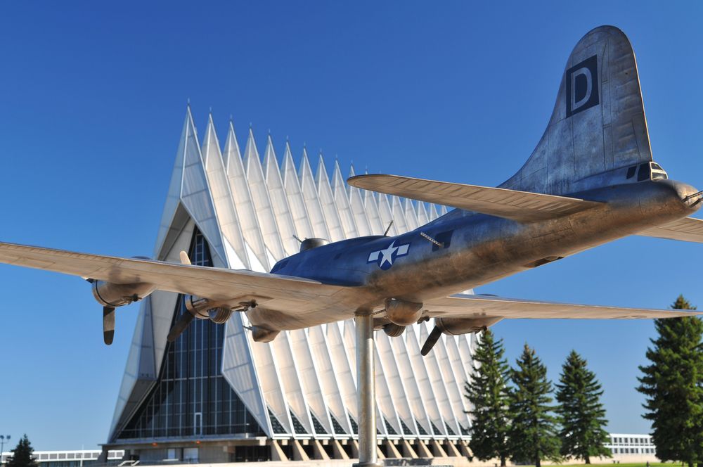 A plane statue in front of Air Force Academy chapel.