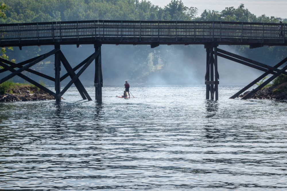 A person paddling on Cheat Lake
