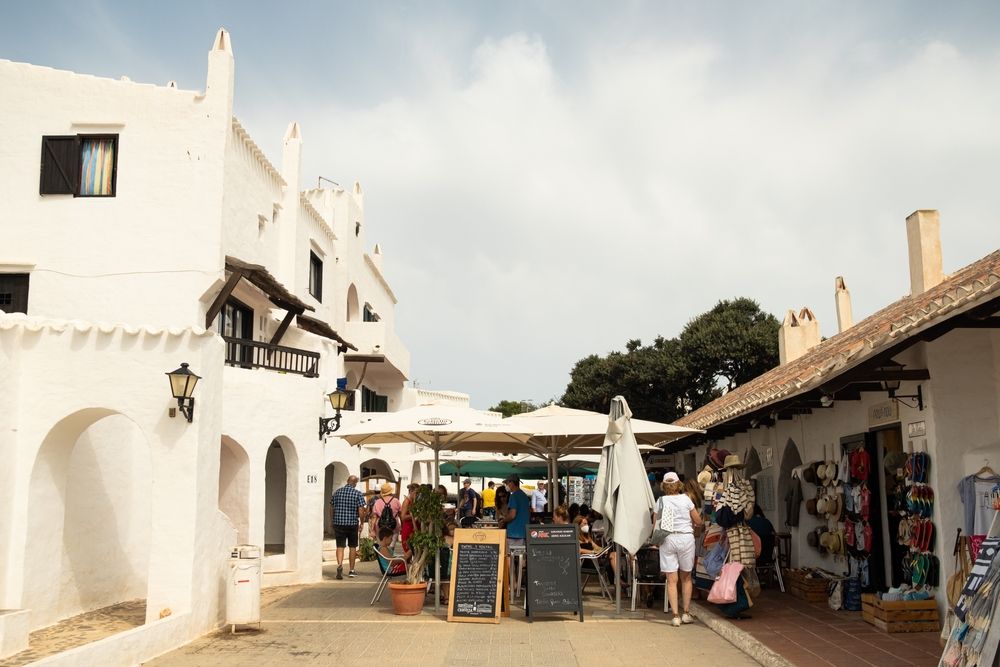 People exploring the shops at Binibeca