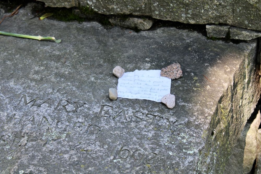 A note attached on one of the Salem Witch Trials Memorial
