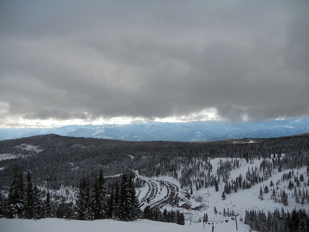 Aerial view of Mt. Shasta ski park with the land blanketed with snow.