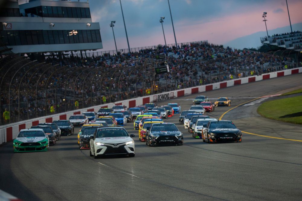 Race cars on Richmond Raceway during a NASCAR event