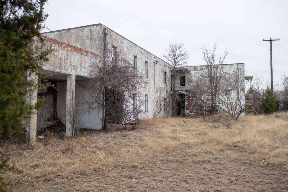 An abandoned pump house building at Fort Wolters