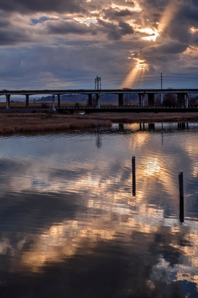 Sunset reflecting on Ebey Waterfront Park's water