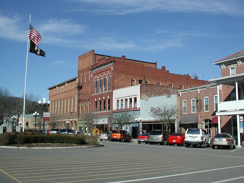 Cars parked in front of Historic Square Arts District's buildings