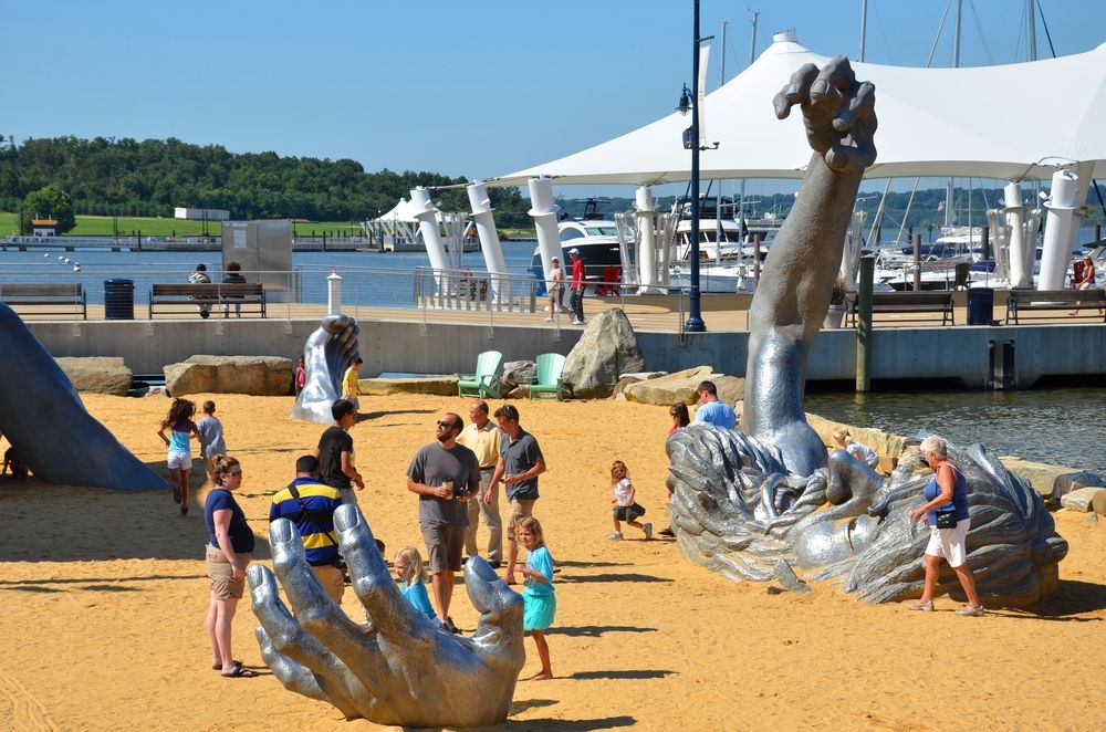 People admiring the Awakening Sculpture