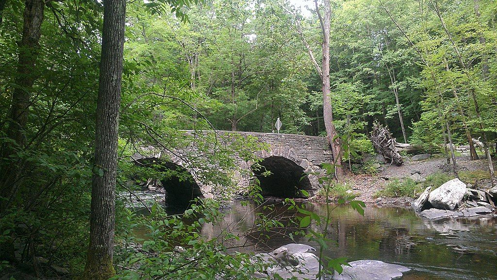 A stone bridge over a river at Tusten Mountain Trail