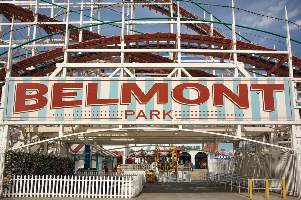 The belmont park entrance with its name written in red.