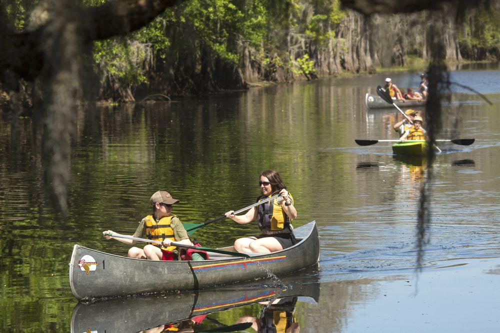 People kayaking on Kissimmee River.