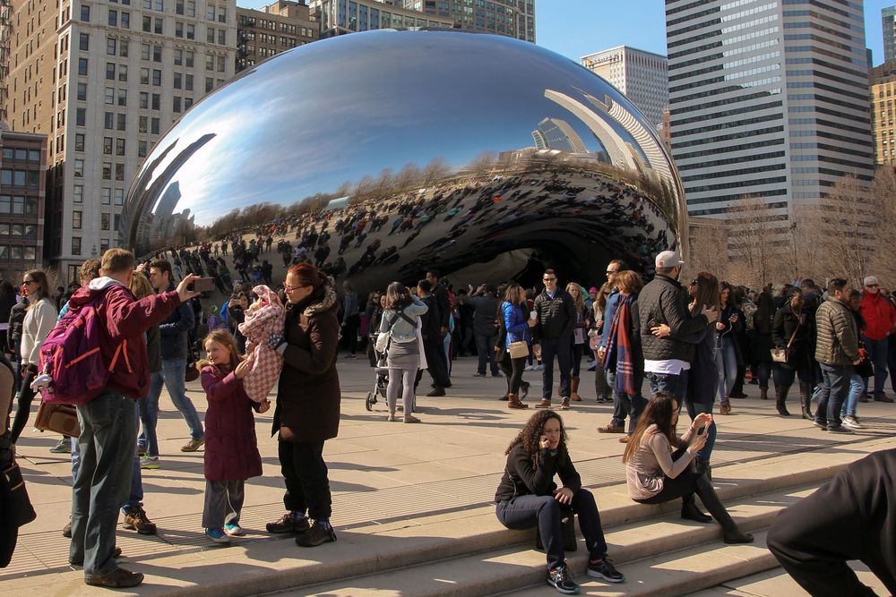 People admiring The Bean
