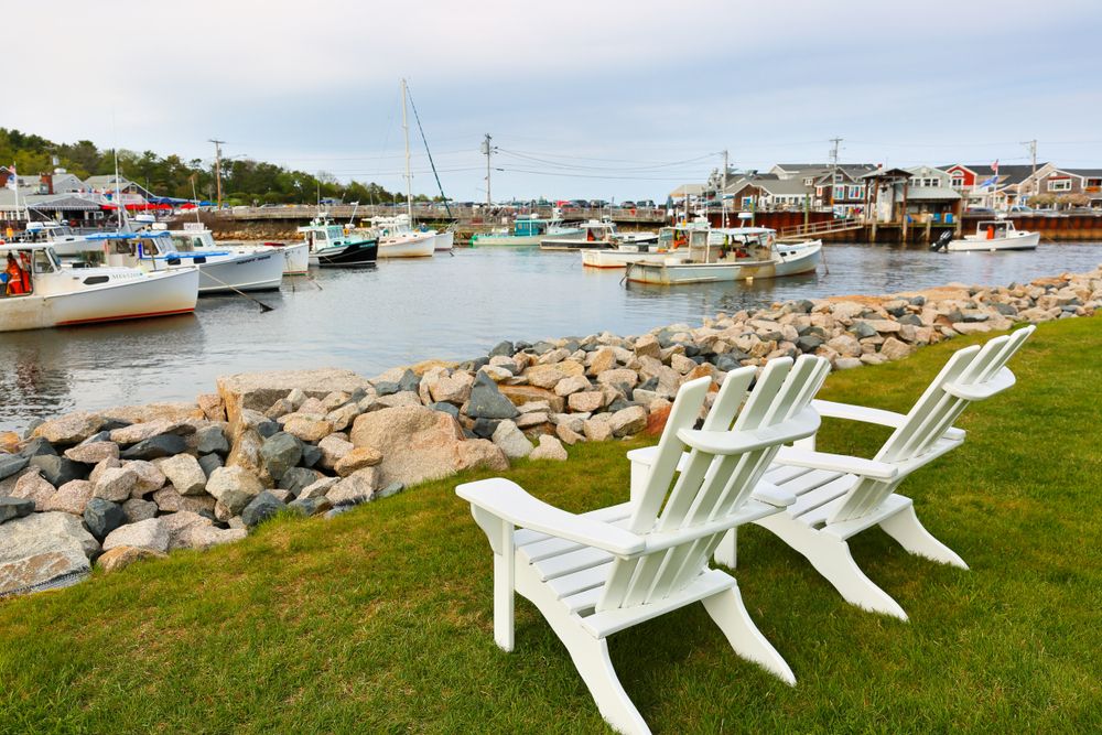 Wooden chairs overlooking the boats at Perkins Cove