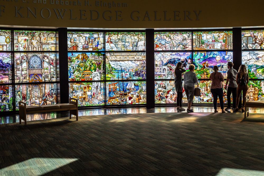 People admiring the Roots of Knowledge