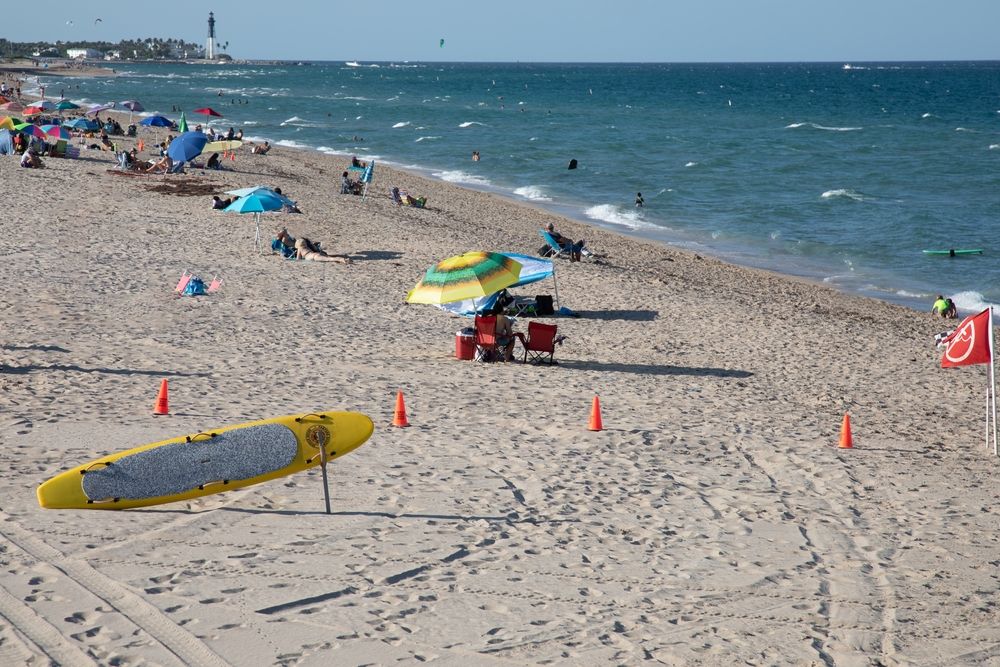 People enjoying the sun at Pompano Beach