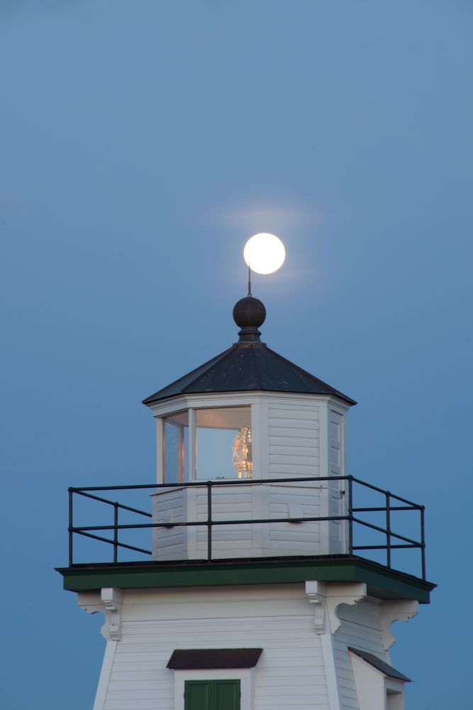 A moon over the Port Clinton Lighthouse
