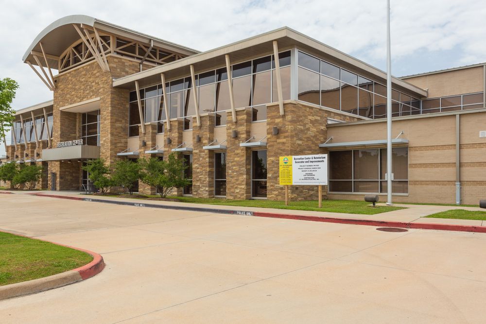 A closer exterior view of the pearland recreation center during daylight.