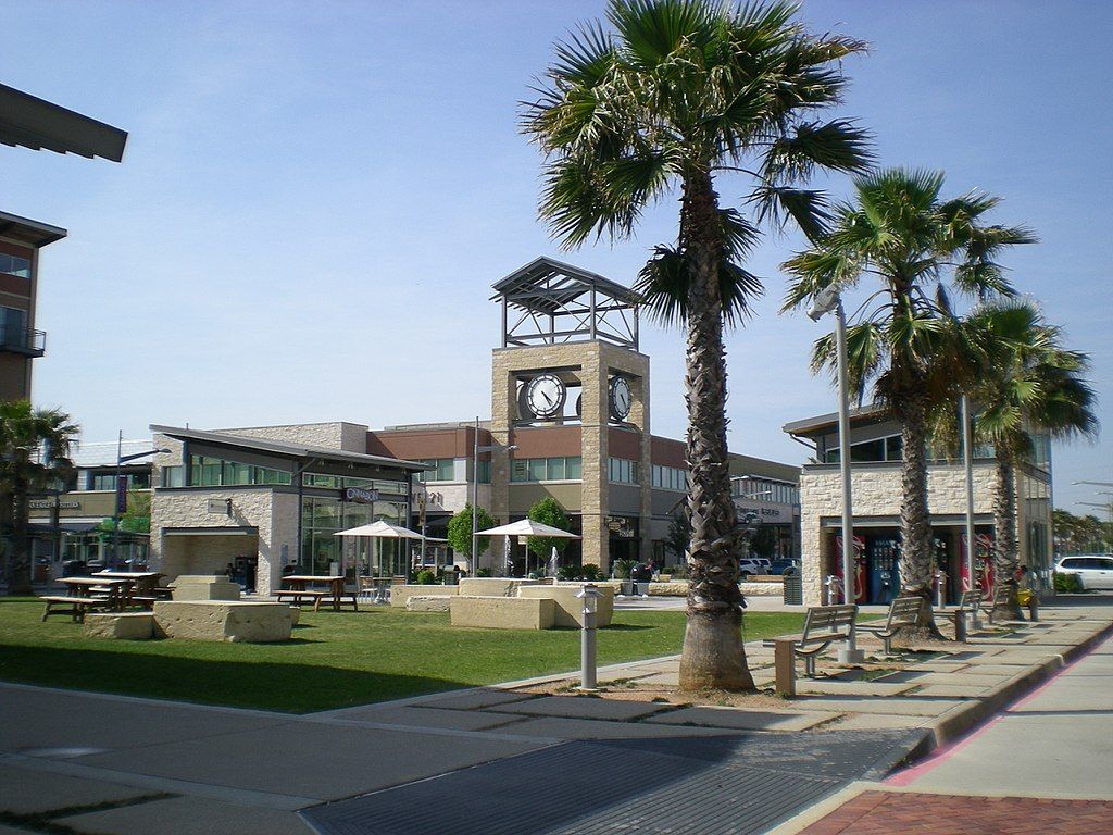 Outside view of the pearland town center with trees along the way.