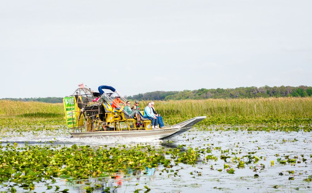 People riding a boat at Lake Tohopekaliga