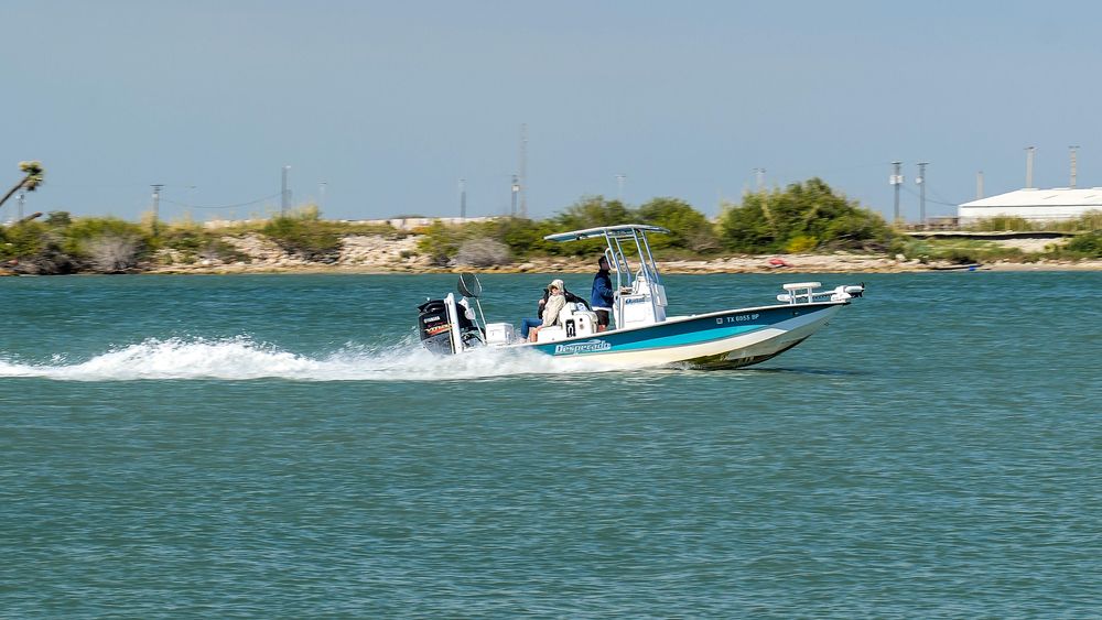 A fast moving fishing boat on the waters of Port Aransas