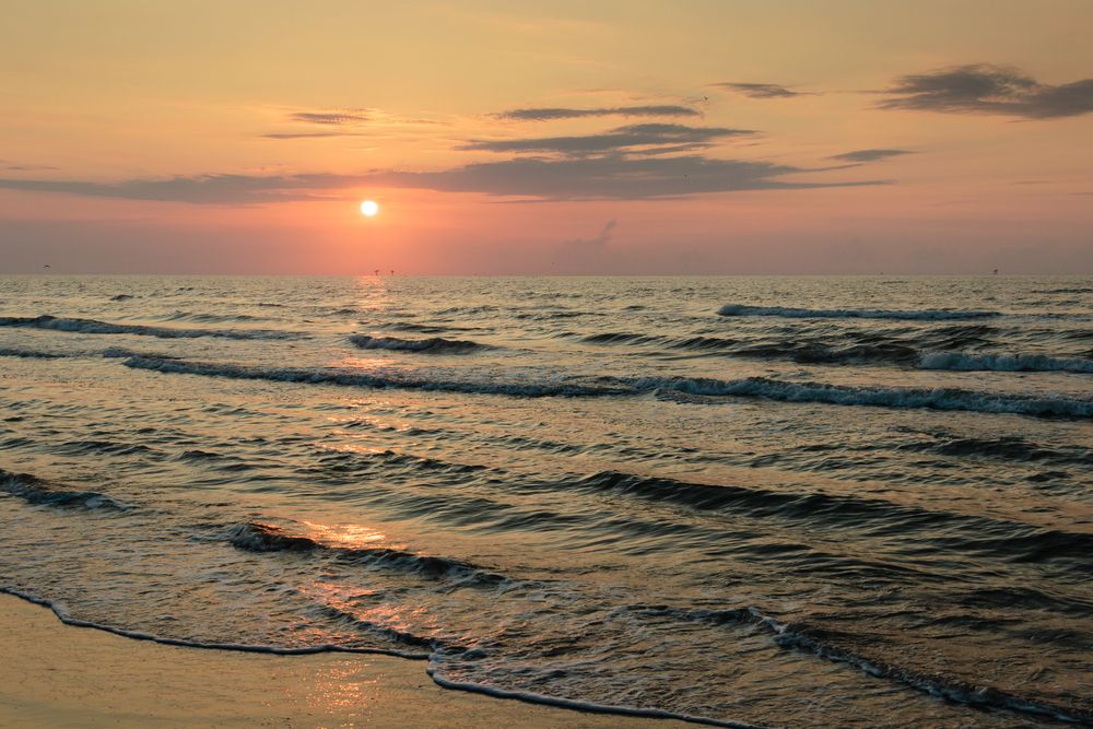 Scenic sunrise reflecting on Port Aransas waters