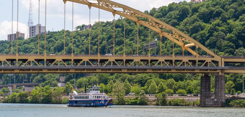 The Gateway Clipper Fleet passing under a bridge