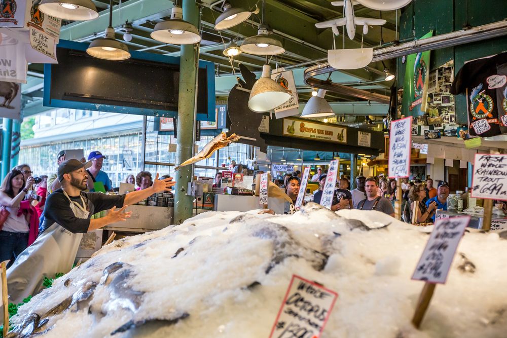 A vendor tossing a fish at Pike Place Fish