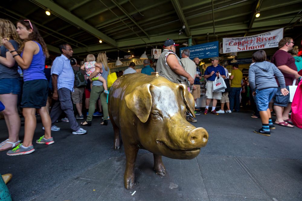 Rachel the Piggy Bank surrounded by shoppers