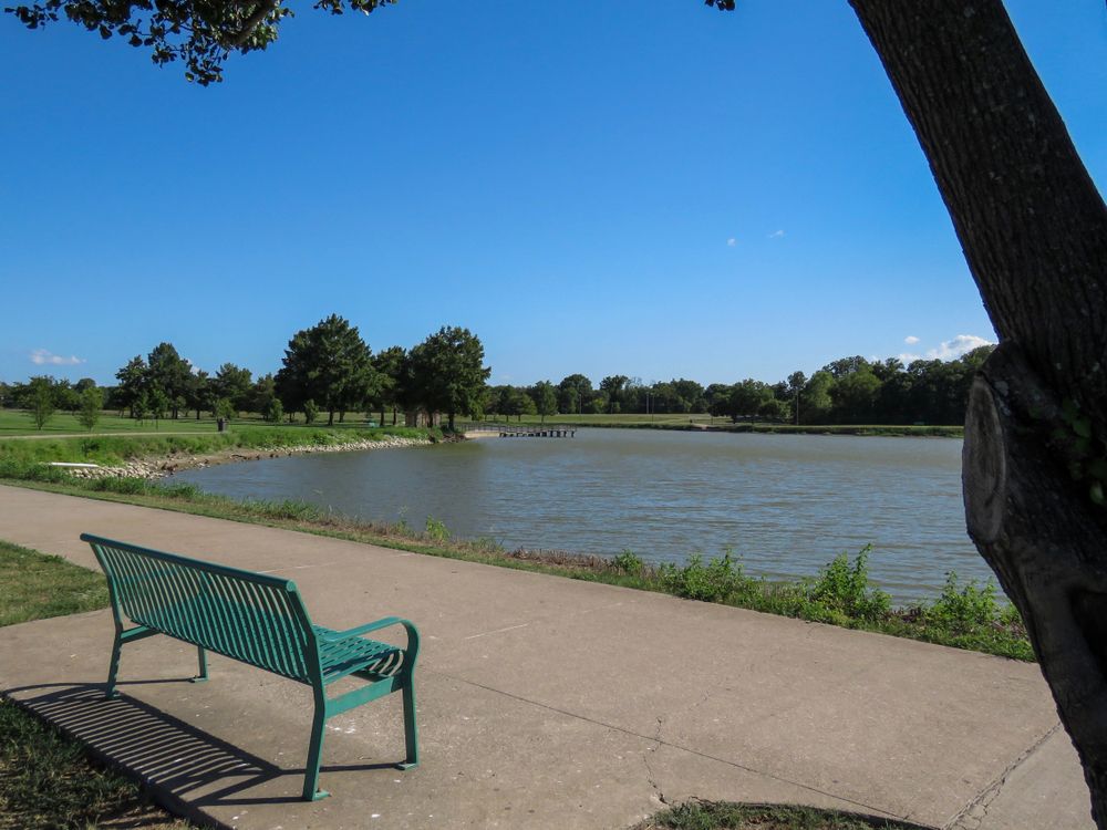 Bench overlooking the waters of Bob Woodruff Park
