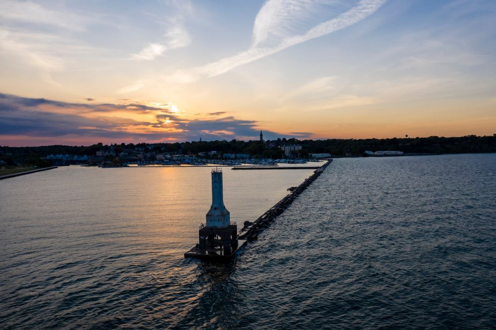Aerial view of Port Washington Breakwater Lighthouse during sunset