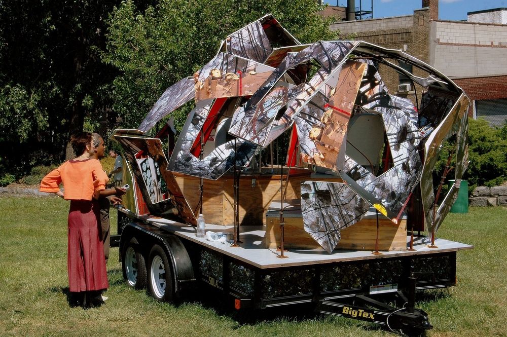 People admiring a sculpture at Socrates Sculpture Park