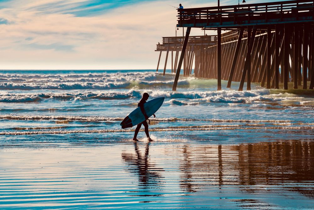 View of a Man below Pismo Pier