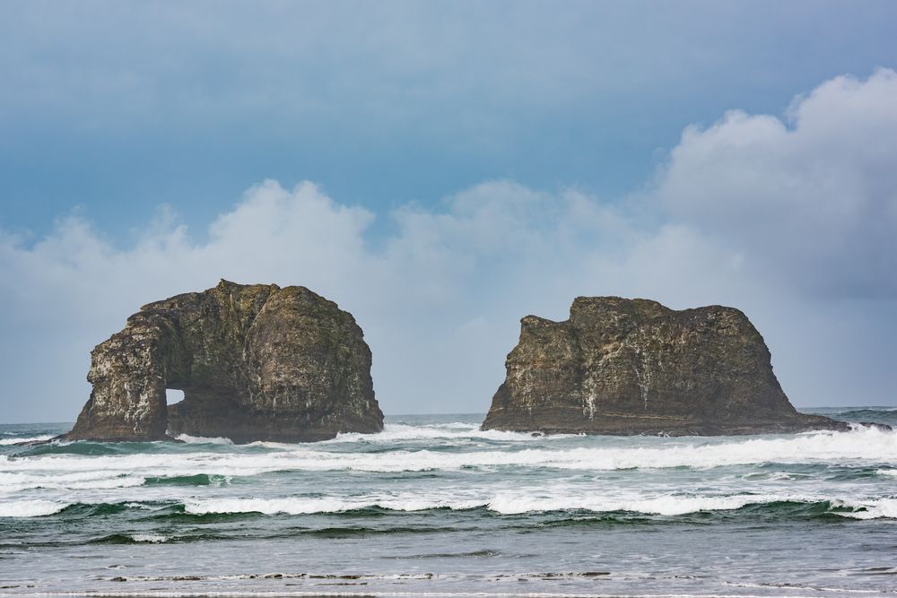 The iconic Twin Rocks in the middle of the water.