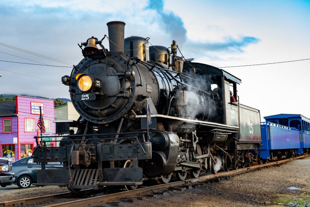 A black steam train at Oregon Coast Scenic Railroad.