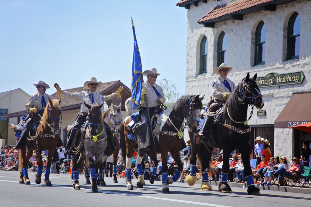 Men riding horses at Swallows Day Parade.