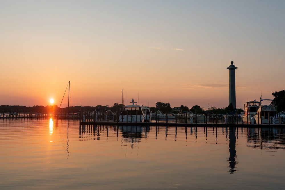 Boats on a dock during sunset