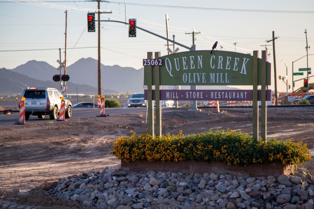 Welcome sign of Queen Creek Olive Mill