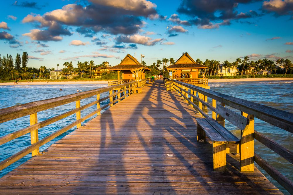 People watching the sunset on Naples Beach pier